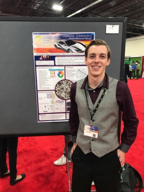 Connor Davies standing in front of his SPE ACCE poster.