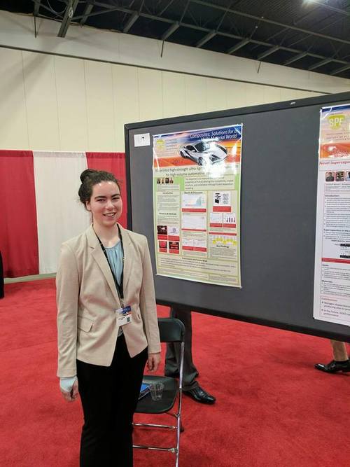 Claire Benwood standing in front of her poster at SPE ACCE.