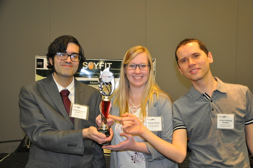 Mateo, Maisyn, and Bruno holding their 1st place trophy.