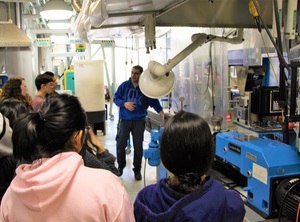 Dr. Mohamed Abdelwahab showing students some of the equipment in the BDDC.